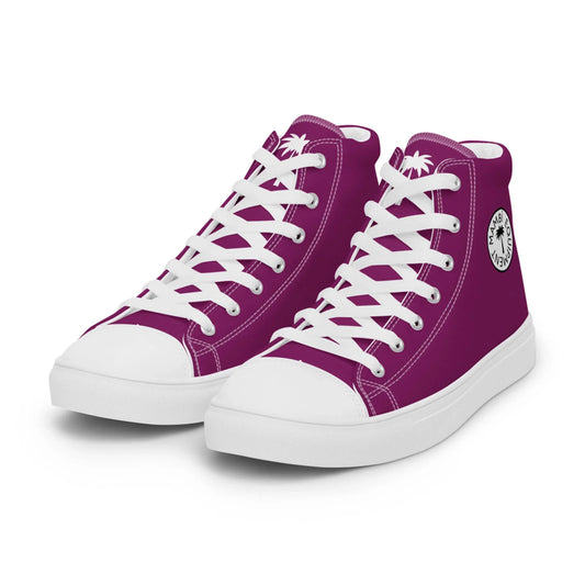 The Carlito Sastre Vintage Hi-Top Sneakers by Printful feature a vibrant white and eggplant design, white laces, toe caps, and soles, plus a round black and white logo on the side and a palm tree graphic on the tongue.