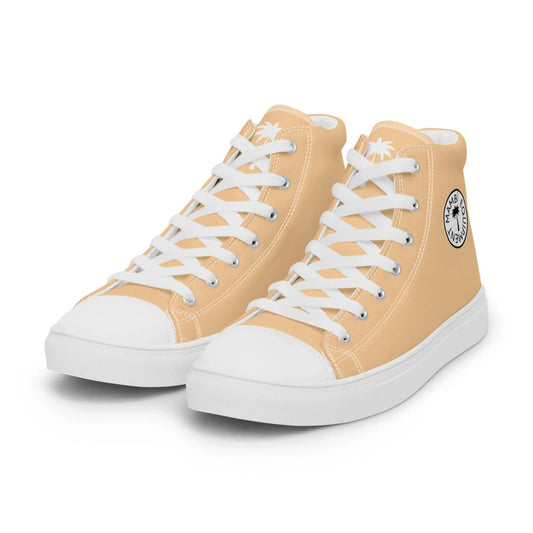A pair of light orange Mambí high-top sneakers with white laces, white soles, and white toe caps. The shoes feature a round black and white logo on the outer side.