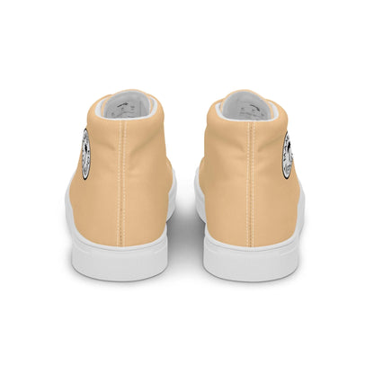 Back view of a pair of light beige Mambí high-top sneakers with white soles. A black and white circular graphic is visible on the outer side of each shoe near the heel.