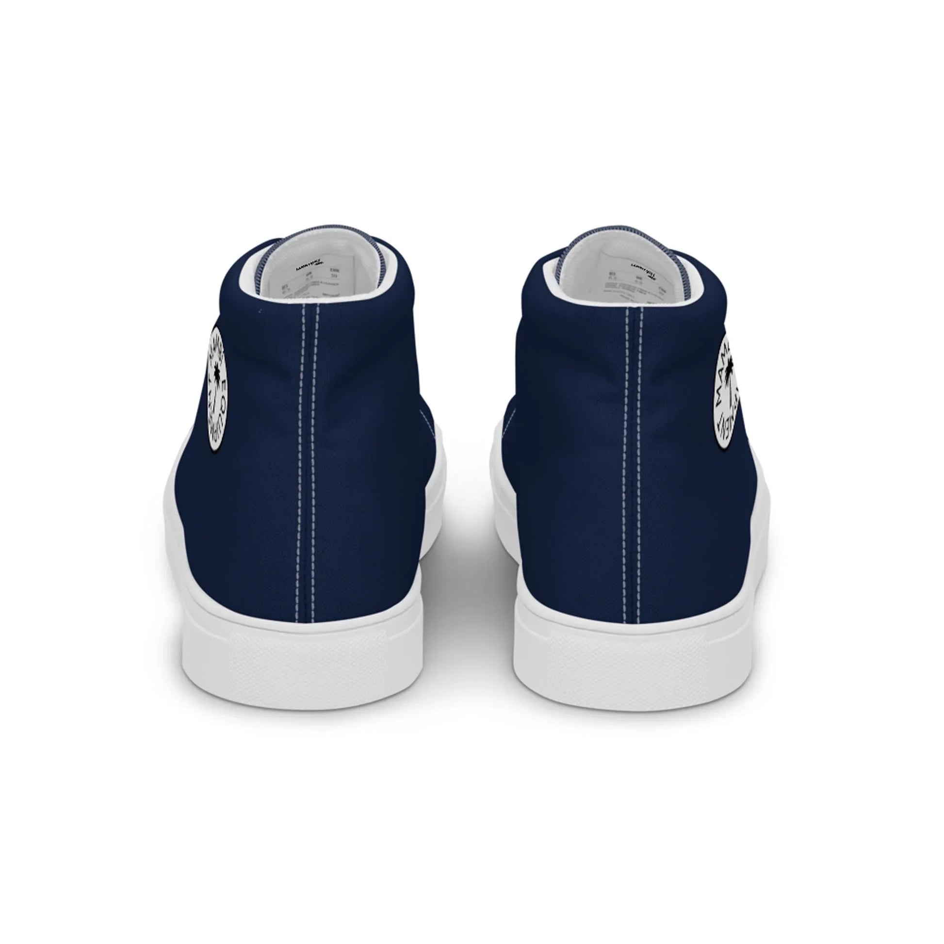 The Carlito Sastre Vintage Hi-Top Sneakers by Printful for women feature a navy and white design with white soles, a circular black-and-white logo on each heel, and clean white canvas interiors.