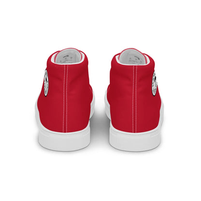 A pair of red Mambí high-top sneakers with white soles, shown from the back. Each shoe features a small black-and-white circular graphic on the heel.