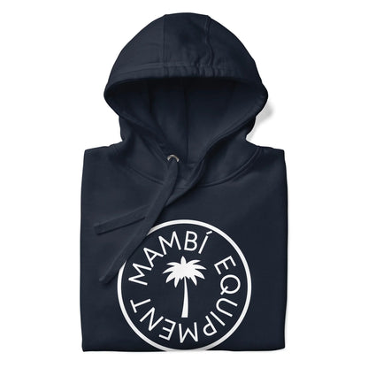 A folded navy blue hoodie with a drawstring hood, featuring a white circular Mambí logo on the chest with a palm tree in the center and MAMBÍ EQUIPMENT around it.