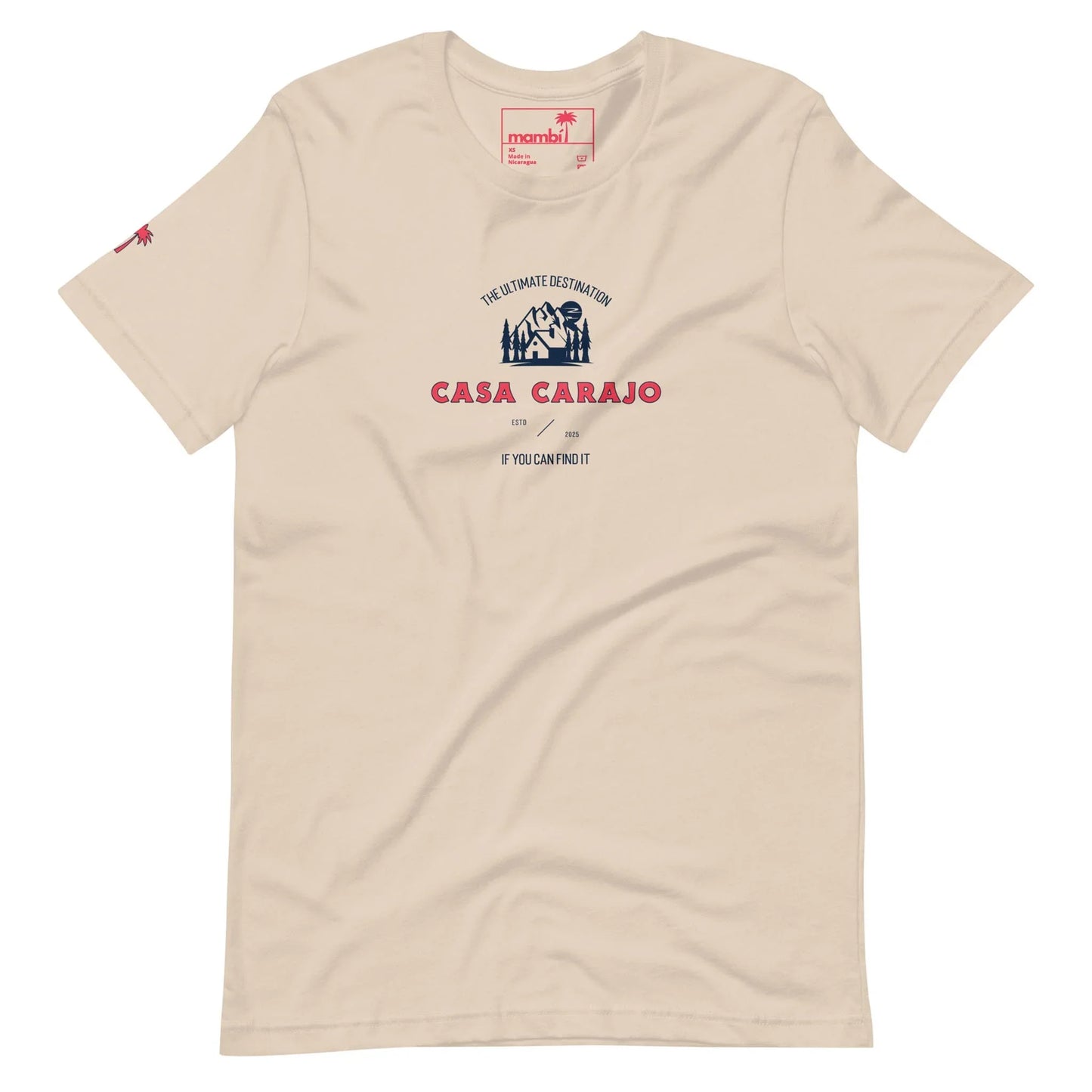 Beige t-shirt with a graphic reading CASA CARAJO in bold red letters, a small hut illustration, and the phrase THE ULTIMATE DESTINATION above. Mambí-inspired design adds character. Small red graphic on the left sleeve.