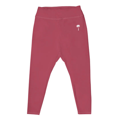 Pink high-waisted Mambí leggings featuring a small white palm tree graphic on the left hip, displayed flat on a white background.