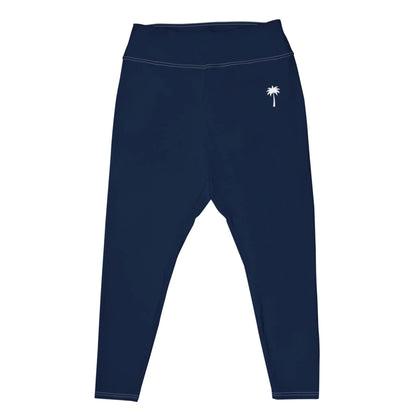 Navy blue high-waisted Mambí leggings featuring a small white palm tree graphic on the left hip. These leggings have a smooth texture and simple stitching along the seams.