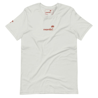White short-sleeve t-shirt featuring a small red palm tree and the word Mambí in lowercase across the chest. A matching red palm tree decorates the left sleeve.