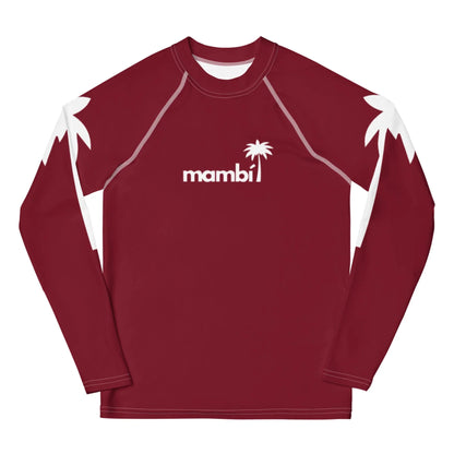 A long-sleeve maroon rash guard featuring white palm tree silhouettes on the shoulders and the word Mambí with a small palm tree graphic above the text on the chest.