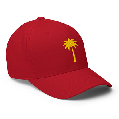 A red baseball cap featuring a simple yellow palm tree design embroidered on the front, inspired by Mambí style.