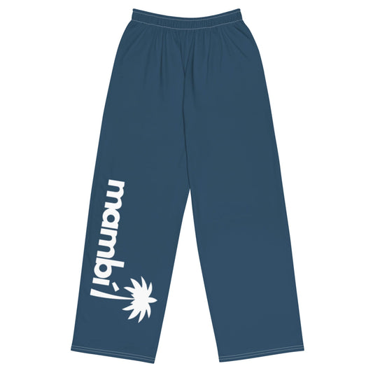 Blue lounge pants with an elastic waistband. The left leg showcases Mambí in large white letters, vertically aligned, above a white palm tree graphic near the ankle.