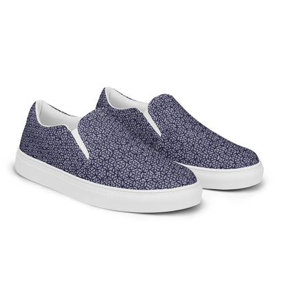 The Digno Handmade Slip-On Canvas Shoes for men by Printful feature a white sole and navy blue upper with a geometric star pattern—perfect for making a stylish statement.