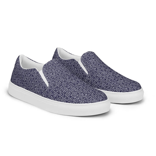 The Digno Handmade Slip-On Canvas Shoes for men by Printful feature a white sole and navy blue upper with a geometric star pattern—perfect for making a stylish statement.