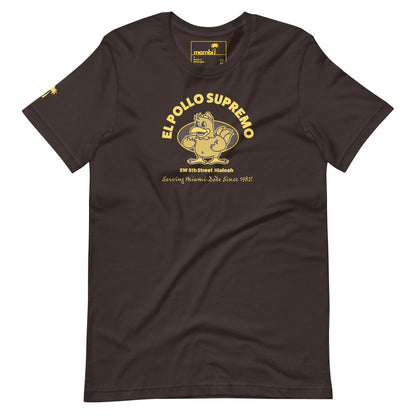 Brown t-shirt featuring a cartoon chicken flexing its muscle, with the text EL POLLO SUPREMO above and SW 8th Street, Hialeah. Proudly celebrating Mambí roots since 1982 in bold yellow below.