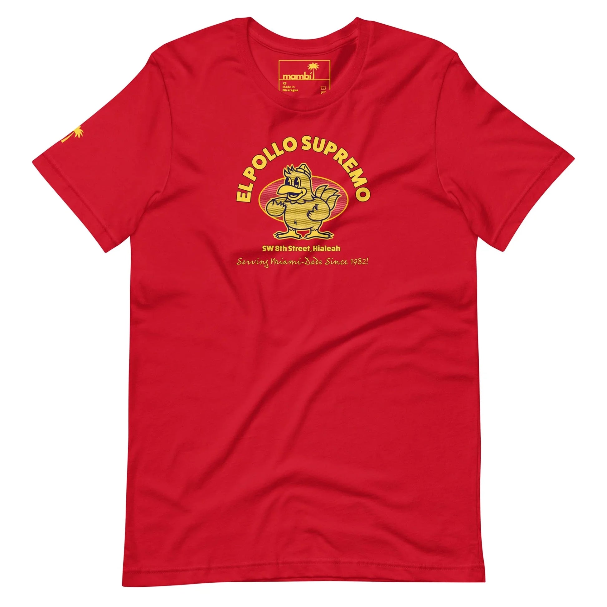 A red T-shirt featuring a cartoon chicken mascot, yellow Mambí text reading EL POLLO SUPREMO, and smaller text below with an address and Serving Hialeahs Best Since 1982.