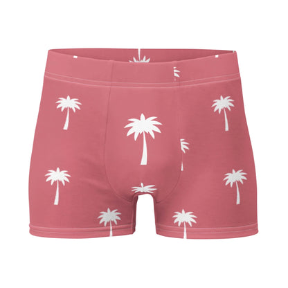 The Printful Emerson Mens Boxer Briefs feature a pink design with white palm trees, no back seam, and a visible waistband, combining comfort and style in every detail.