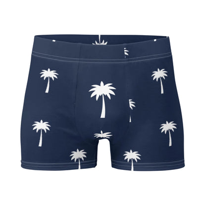 The Emerson Boxer Brief by Printful in navy blue features a white palm tree pattern and a seamless, no-back-seam design, shown against a plain white background.