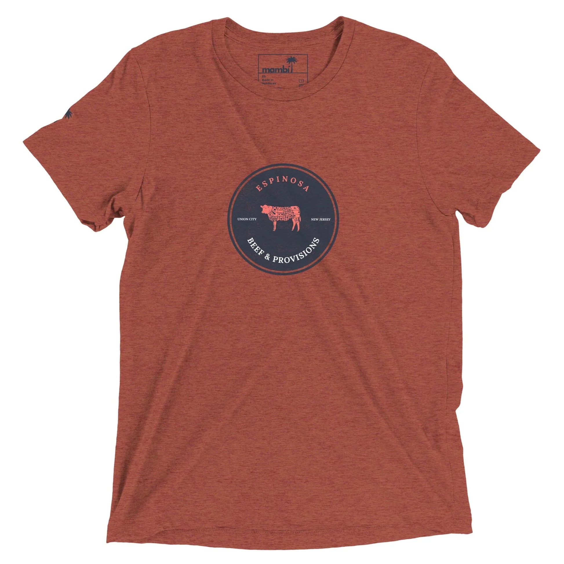 A heathered rust-colored Mambí t-shirt with a circular navy logo in the center featuring a cow illustration and the text ESPINOSA BEEF & PROVISIONS, along with Texas Born and Family Raised.