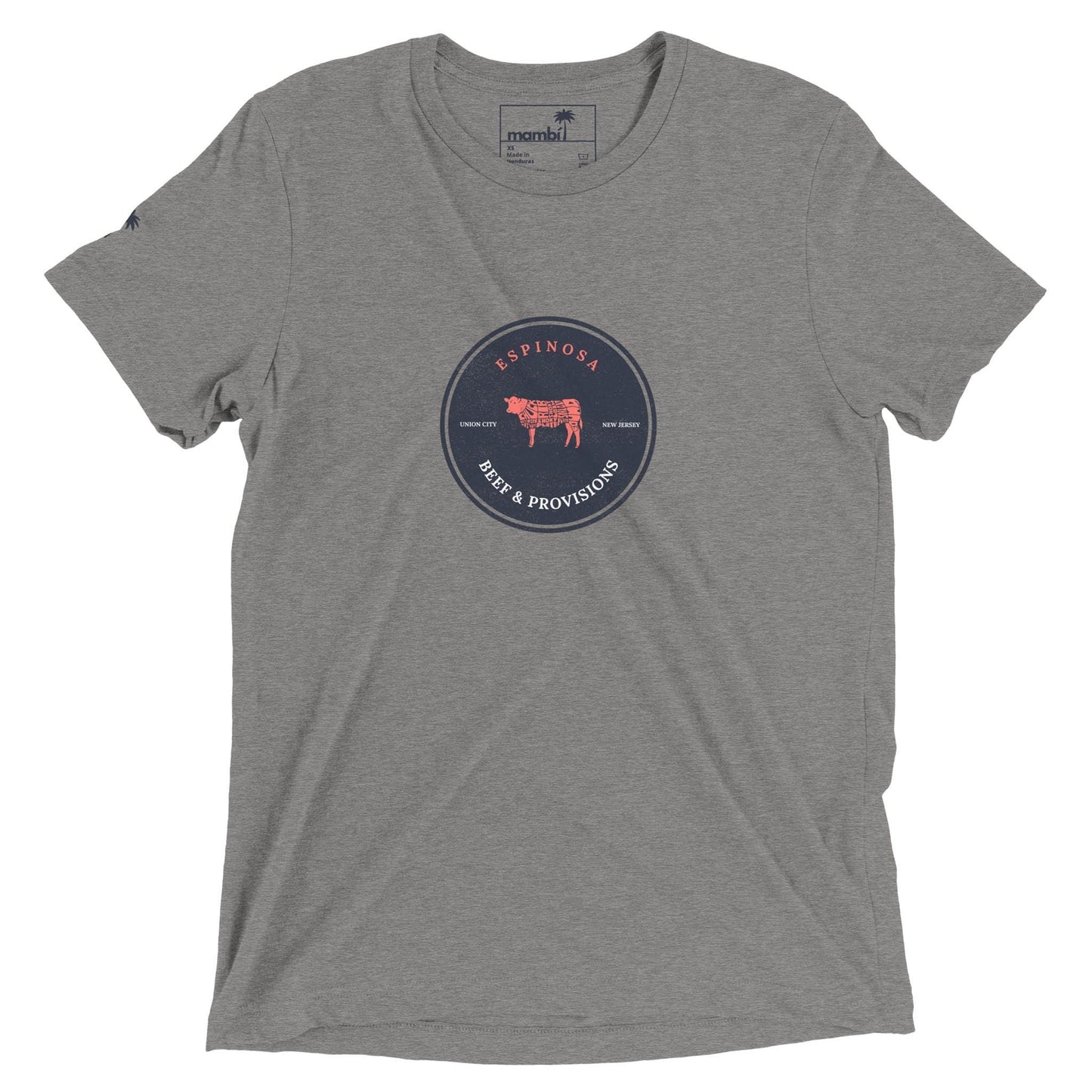 A heather gray t-shirt with a circular navy blue logo in the center reading Espinosa Beer & Provisions and featuring a red cow illustration. The brand name Mambí is printed inside the collar.