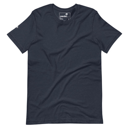 A plain, short-sleeved, navy blue Mambí T-shirt is laid flat on a white background. The shirt features a small palm tree logo on the left sleeve and a visible neck tag with branding.