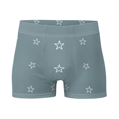 Light blue Mambí men’s boxer briefs featuring a pattern of white outlined stars on a plain white background.