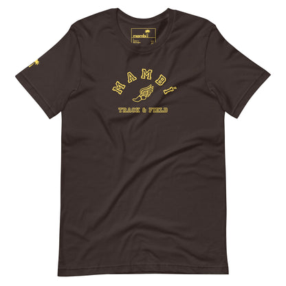 A brown Mambí T-shirt featuring yellow text that reads MAMBI above a winged shoe graphic and TRACK & FIELD below, with a yellow logo on the inner collar and a small yellow graphic on the left sleeve.