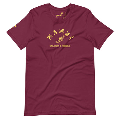 A maroon t-shirt with yellow text that reads Mambí Track & Field and features a winged shoe graphic between the words. The shirt has short sleeves and a crew neckline.