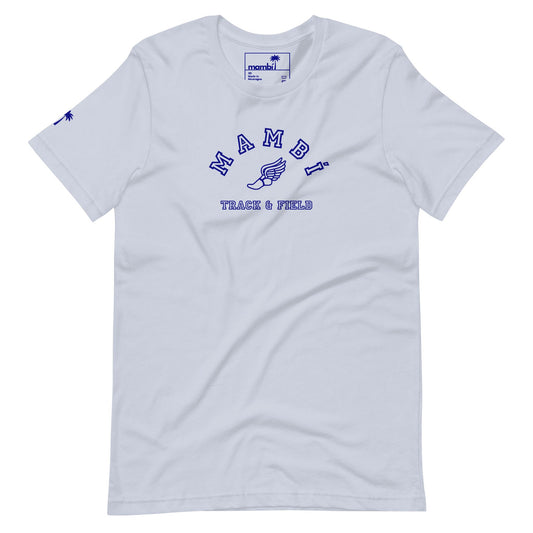 White t-shirt with Mambí in blue letters across the chest, a winged shoe graphic underneath, and TRACK & FIELD below. Features a small blue logo on the left sleeve and a branded tag on the collar.