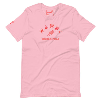 A light pink Mambí T-shirt with red text reading TRACK & FIELD and a winged foot graphic in the center. A small red palm tree accents the left sleeve.