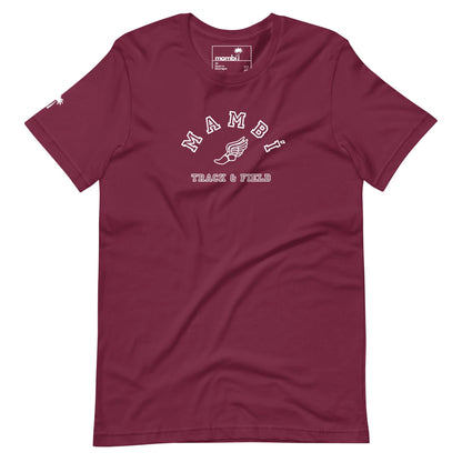 A maroon t-shirt featuring MAMBA and TRACK & FIELD in white lettering, a winged shoe graphic beneath, and a subtle Mambí touch for added style.