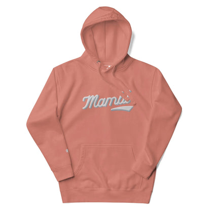A coral pink hooded sweatshirt featuring the word Mami in white, cursive script across the chest, inspired by Mambí style and complete with a front kangaroo pocket.