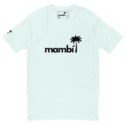 Light-colored Mambí t-shirt featuring the word “mambi” in bold black letters, with a black palm tree graphic as the letter “i.” A smaller palm tree icon is on the left sleeve near the shoulder.