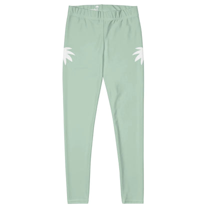 Light green Mambí leggings with a high waist and fitted design, featuring two white abstract leaf shapes on the outer sides of each hip. The leggings are laid flat on a white background.