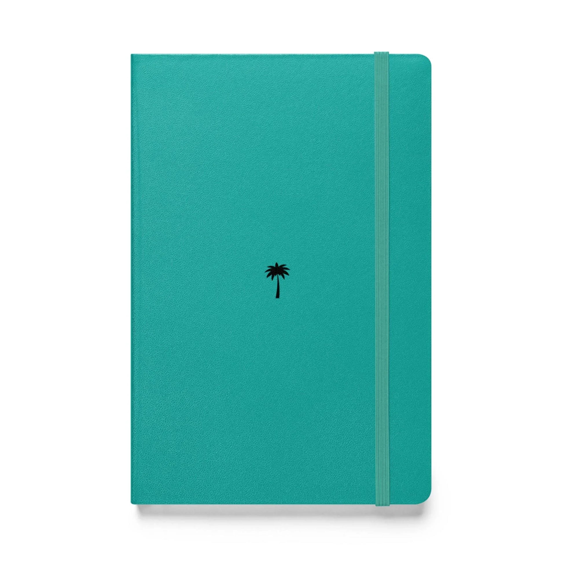 A teal-colored Mambí notebook features a small black palm tree icon in the center and an elastic band closure running vertically along the right side.