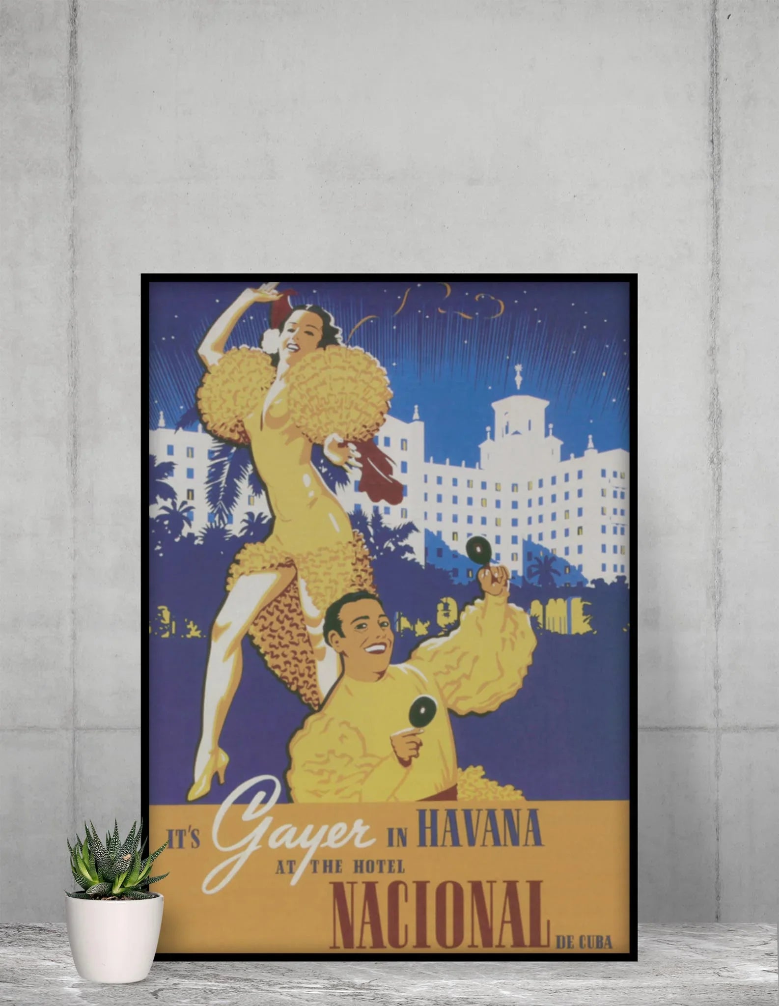 The Hotel Nacional Reprinted Vintage Poster by Printful (24x36, premium luster paper) features two dancers in yellow with maracas, the hotel’s white building aglow behind them, and a festive scene full of Cuban elegance.