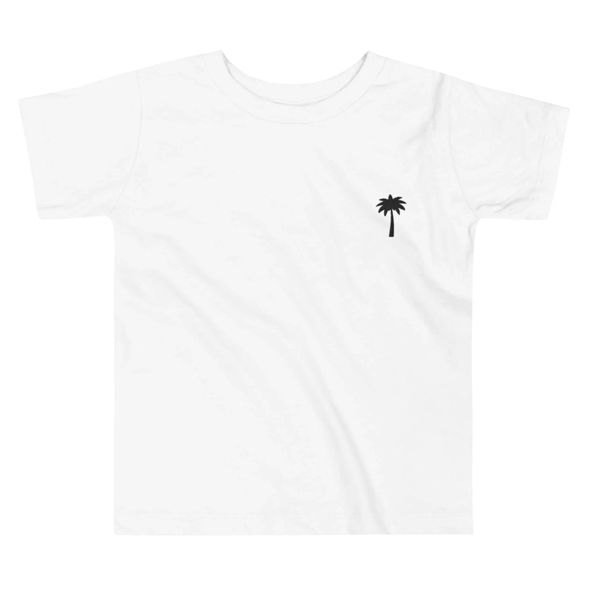 White t-shirt featuring a small black palm tree graphic on the left chest area. This minimal design captures a relaxed, Mambí-inspired vibe.