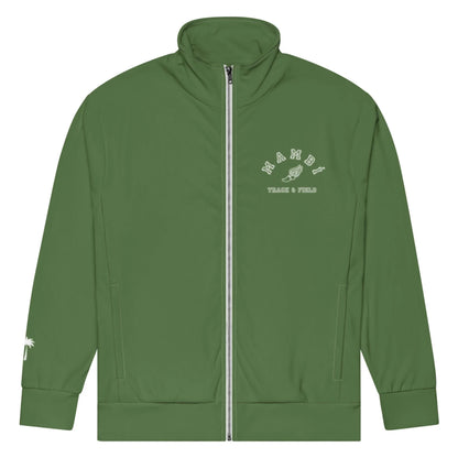 A green Mambí track jacket with a full front zipper. The left chest features white text reading “MIAMI TRACK & FIELD” with a winged shoe graphic, while a small white palm tree graphic accents the left sleeve near the cuff.
