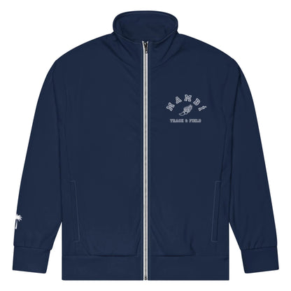 Navy blue track jacket with a front zipper, featuring MIAMI Track & Field, a shoe graphic on the left chest, and a subtle Mambí touch with a small white palm tree design on the right sleeve near the wrist.