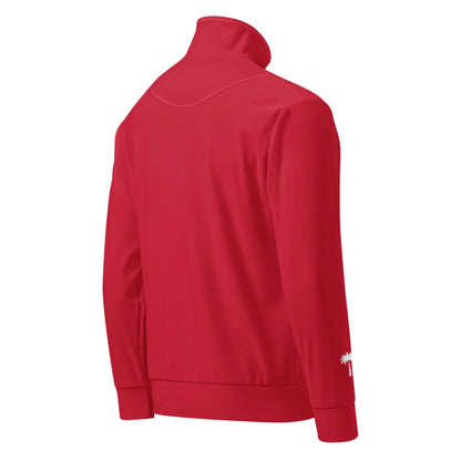 A red, long-sleeve Mambí track jacket viewed from the back, featuring a high collar, ribbed cuffs and hem, and a small white palm tree graphic near the left wrist.