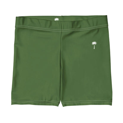 Green swim trunks with white stitching, featuring a small white palm tree graphic on the left leg, a smaller palm tree on the back waistband, and subtle Mambí detailing.