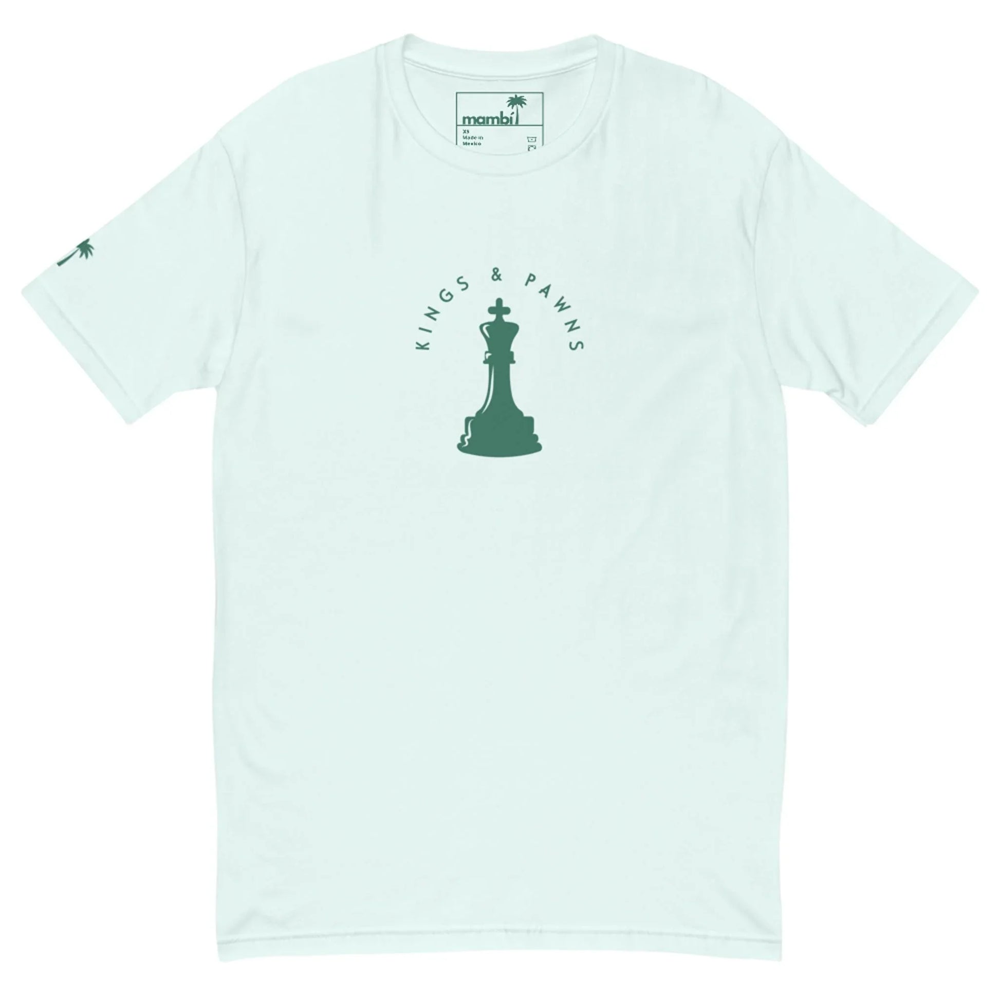Light blue Mambí t-shirt featuring a green chess king piece graphic in the center, surrounded by the words “KINGS & PAWNS.” A small palm tree accents the left sleeve.