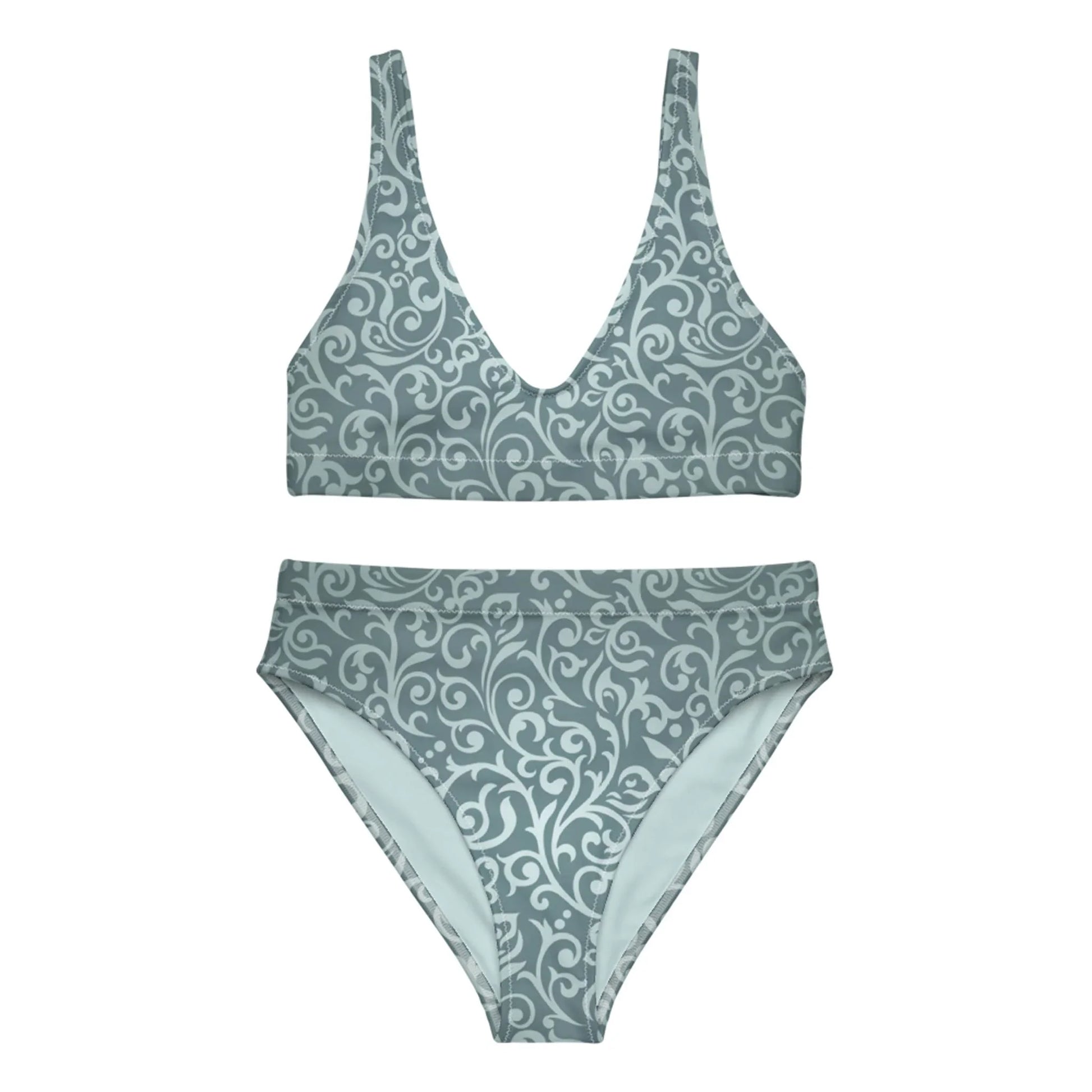 The Laurelia High-Waisted Bikini Swimsuit for women by Printful is a muted teal set with a deep V-neck top, removable pads, and matching bottoms, both featuring an elegant light swirl and floral pattern.