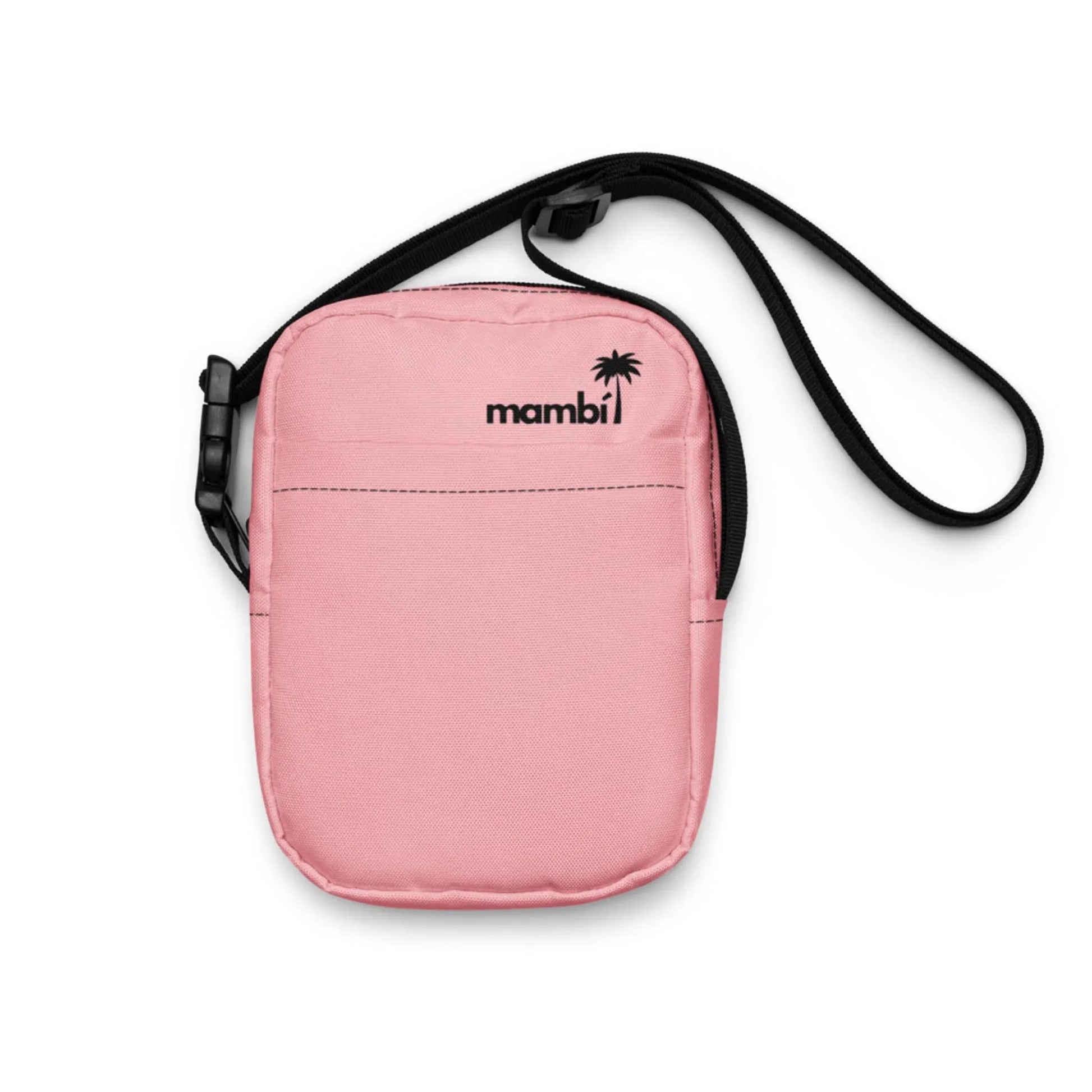 A small, light pink Mambí crossbody bag with a black strap and buckle, featuring the word mambi and a small palm tree logo printed in black on the front.