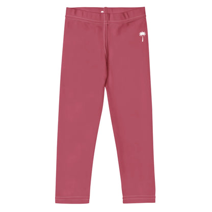 Pink Mambí leggings featuring a white palm tree graphic near the left hip, shown laid flat on a white background.