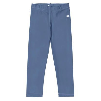 Blue Mambí leggings with a white palm tree graphic on the left hip, laid flat on a white background.