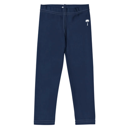 Navy blue Mambí leggings with white stitching, featuring a small white palm tree graphic near the waist on the left side. The leggings are laid flat against a white background.