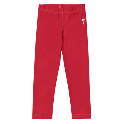 Red leggings with white stitching and a small white palm tree graphic near the waistband on one side, inspired by Mambí style, displayed on a white background.