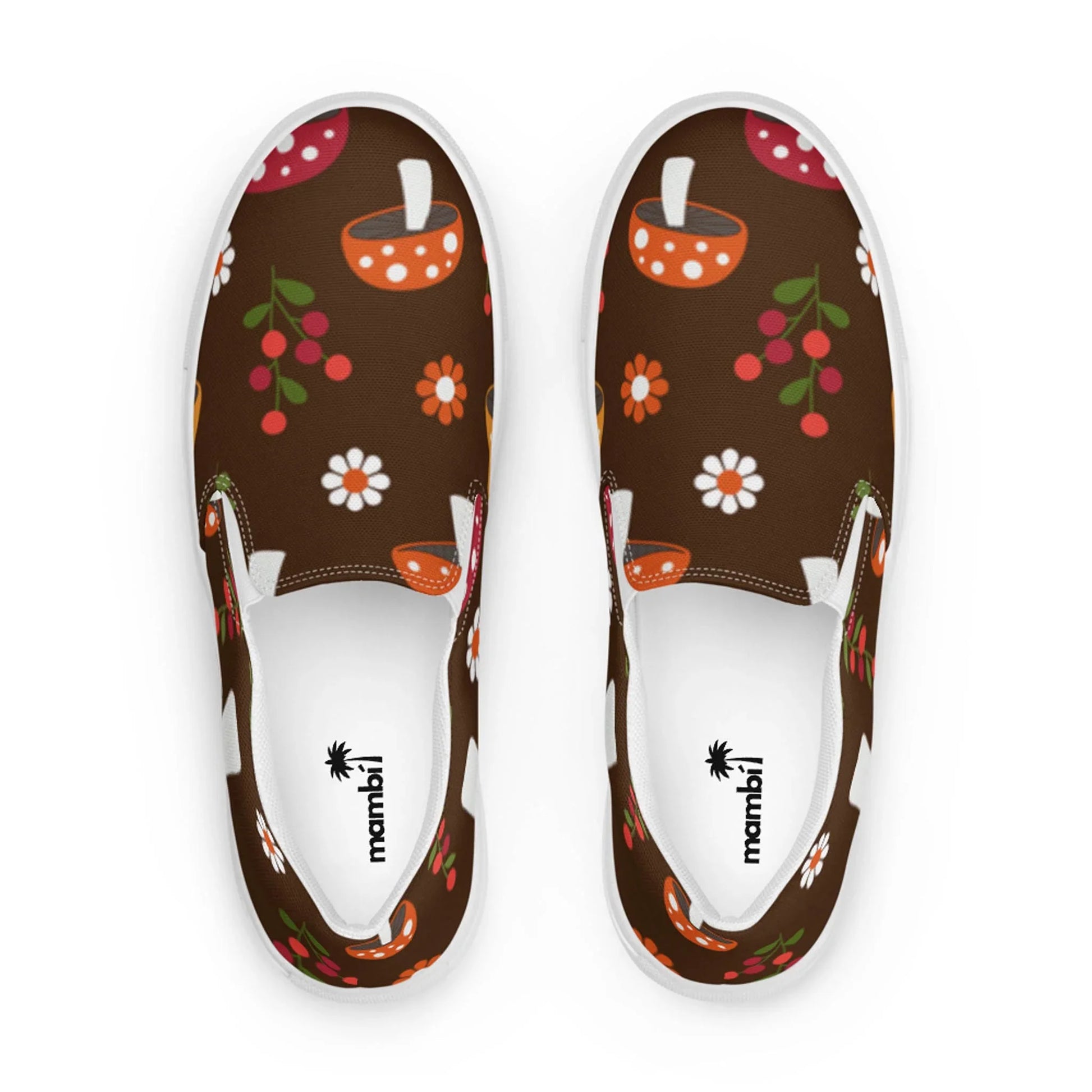 Step out in style with the Mario Handmade Slip-On Canvas Shoes for men by Printful, featuring a brown canvas adorned with vibrant flowers, berries, and orange bowls. The inner soles display the mambil logo with a palm tree icon—perfect for making a statement.