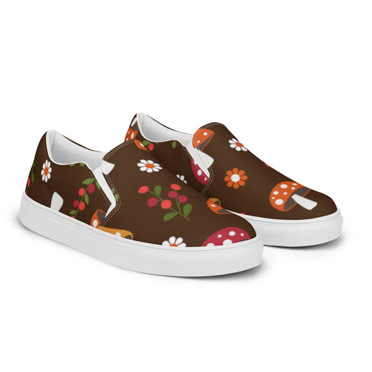 The Mario Handmade Slip-On Canvas Shoes for men by Printful feature a vibrant mushroom, flower, and leaf pattern on brown canvas with white soles and lining—perfect for a bold, fun fashion statement.
