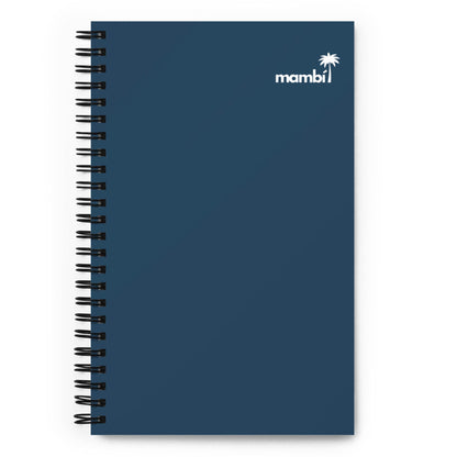 A navy blue custom wire-bound notebook featuring a small white palm tree and the word mambi in the top right corner of the cover.
