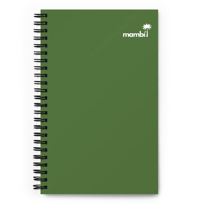 A green spiral notebook with mambi and a small white palm tree graphic printed in the top right corner of the cover.