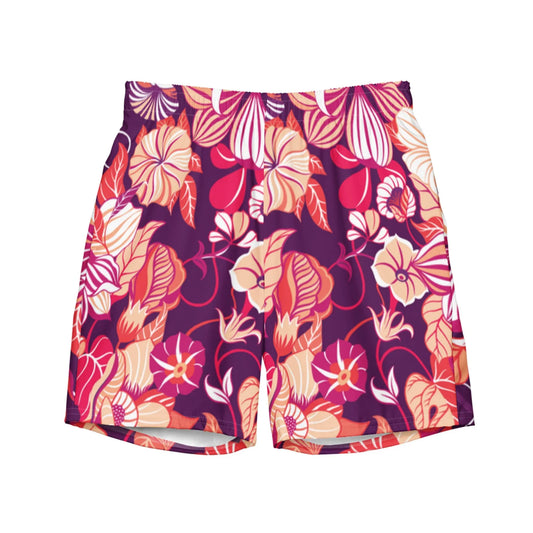 The Mauricio Swim Trunks for men by Printful feature a bold floral pattern in orange, red, and cream on dark purple microfiber, with various leaves and flowers for a vibrant tropical look plus an anti-chafe liner for comfort.